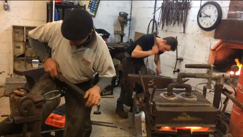Andy Martin and James Martin shoeing a horse, Hook Norton Farriers, Oxfordshire